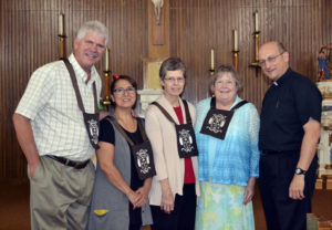 Contributed Members of the Secular Discalced Community of St. Joseph and the Prophet Elijah who made promises Aug. 15 are, from left, Brad Johnson, Aurora Johnson, Gail Devereaux and Lynn Carlton with Father John Thieryoung. 