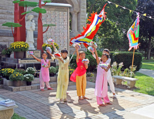 Anne Marie Amacher Girls dance before a statue of Our Lady of LaVang in the courtyard of Sacred Heart Cathedral in Davenport. The Vietnamese Catholic community celebrated the Solemnity of the Assumption of the Blessed Virgin Mary on Aug. 16. 