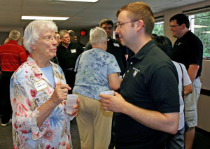 Anne Marie Amacher Sister Marie Vittetoe, CHM, and Father Thom Hennen, director of vocations, talk about sister’s work in “caring ministry.” Clergy and women religious were invited to the Serra Club “picnic” Aug. 9 at the Knights of Columbus Hall in Davenport. 