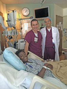 Contributed Neurosurgeon Dr. Chandan Reddy and vascular surgeon Dr. Luigi Pascarella visit with Claudami Jean Lor of Haiti after her surgery earlier this summer. Thanks to a connection between Haiti and St. John Vianney Parish in Bettendorf, Claudami was able to receive surgery at the University of Iowa Hospitals and Clinics for a tumor that could not be removed in Haiti. 