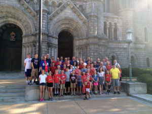 Contributed  Altar servers and other Catholics from the Burlington area stand in front of the Cathedral Basilica of St. Louis this past summer. 