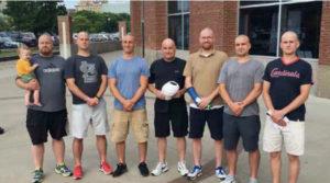 Contributed Rand Wonio, holding hat, is joined by his six sons who shaved their heads as a sign of solidarity as their dad battled cancer.