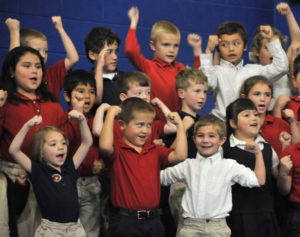Lindsay Steele All Saints Catholic School K-2 Children’s Choir members sing about the strength of soldiers during a Veterans Day program at the Davenport school Nov. 10. 