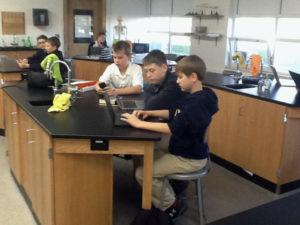 Lee Lundvall Burlington Notre Dame seventh-graders Cade Hoambrecker, Josh Gavin and Taylor Sankus work in the school’s new science lab. Students at Catholic schools in the Diocese of Davenport can receive financial aid through the School Tuition Organization program. 