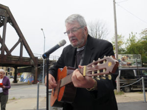 Anne Marie Amacher Father Brian Miclot plays the guitar Oct. 20 for patrons of Father Conroy’s Vineyard of Hope. 