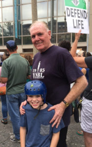 Contributed  Ray Flynn, former mayor of Boston and U.S. ambassador to the Vatican, spends time with his grandson Braeden O’Doherty, who has a rare neurological disorder, at a pro-life rally earlier this year. Flynn has joined the board of directors of the John Paul II Medical Research Institute, based in Coralville.