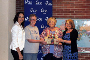 Contributed Gathered to recognize “Superstars” for CRS Rice Bowl are, from left: Teresa Bush Dunbar, relationship manager with CRS Midwest; superstar Lori Ferris, a volunteer at Ss. Mary & Mathias Parish in Muscatine and for CRS Rice Bowl in the Diocese of Davenport; superstar Loxi Hopkins, a volunteer for the diocese; and Joan Rosenhauer, executive vice president for U.S. operations with CRS.  