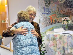 Lindsay Steele Sister Maria Zeimen, OSF, greets associate Marion Johnson with a hug during a 150th anniversary celebration of the Sisters of St. Francis in Clinton Jan. 21.