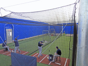 Anne Marie Amacher Members of the St. Ambrose University baseball team practice in a batting cage in the new Ambrose Dome. The dome collapsed in 2015 and was reopened last month. 