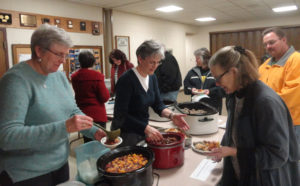 Contributed Members of St. Anthony Parish-Knoxville’s Social Action Committee serve Rice Bowl meals to parishioners after Mass the weekend of Feb. 6-7. The parish is incorporating lessons and acts of mercy into their Lenten observances this year. 