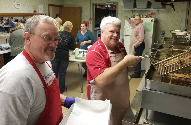 Keith Gehling Knights of Columbus Council 3905 members Dan Wesley and Gary Thompson fry catfish at Houghton’s Knights of Columbus Hall on Feb. 5. The council hosts fish fries year-round.