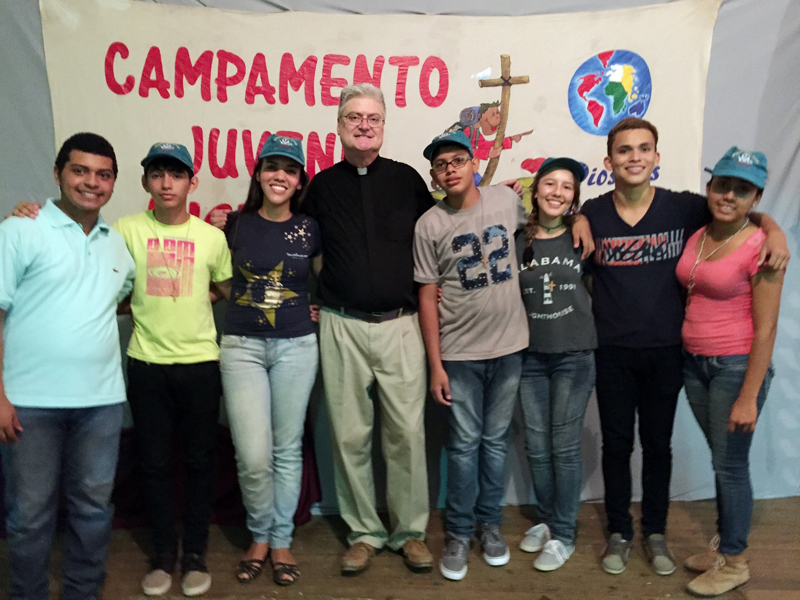 Contributed Father Chris Young stands with youths at a youth gathering in Costa Rica earlier this year. Fr. Young participated in a Spanish immersion program for four weeks there. 