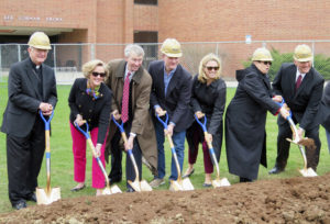 Anne Marie Amacher Bishop Martin Amos and others involved in the Building Our Future capital campaign break ground April 7 for a new $18.5 million Wellness and Recreation Center at St. Ambrose University in Davenport. 