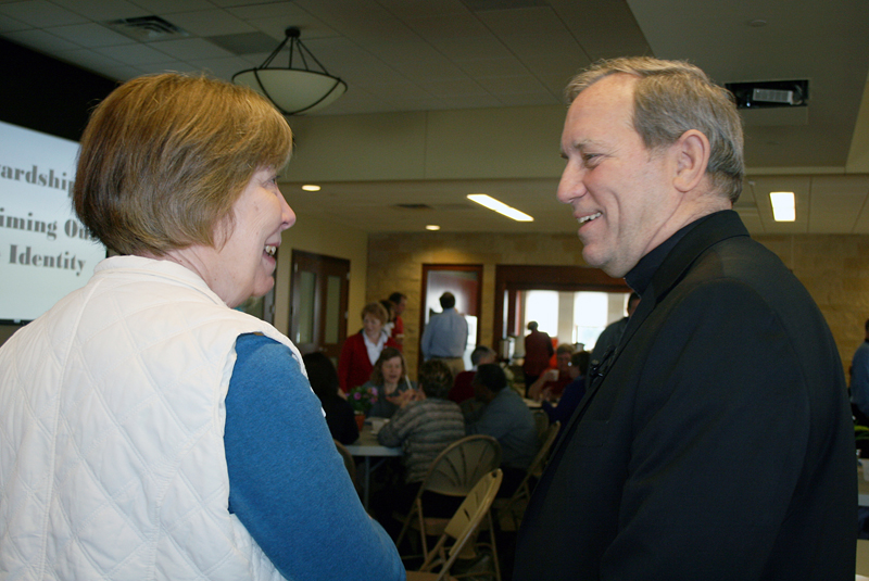 Barb Arland-Fye Alicia Owens, Victim Assistance Coordinator for the Diocese of Davenport, visits with Bishop Bob Gruss of the Rapid City (S.D.) Diocese during Stewardship Day. Bishop Gruss gave a talk during the event of the Davenport Diocese, held April 7 at St. Patrick Parish in Iowa City. 