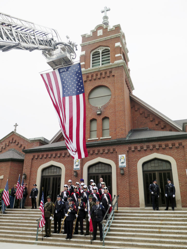 Anne Marie Amacher Members of the Knights of Columbus and honor guard members of the Davenport and Bettendorf police departments, Davenport Fire Department and Scott County Sheriff’s Office pose in front of St. Paul the Apostle Church May 16 before the celebration of the Blue Mass.