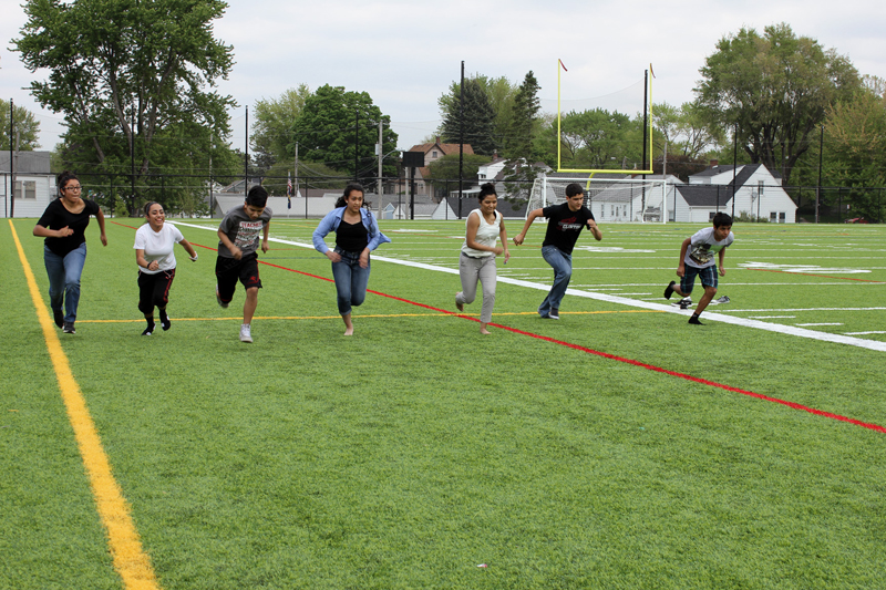 Barb Arland-Fye Youths race on the sidelines of the multipurpose fields of the St. Vincent Athletic Complex in Davenport. Races were one of several activities held May 7 for Hispanics throughout the diocese as a Year of Mercy celebration.