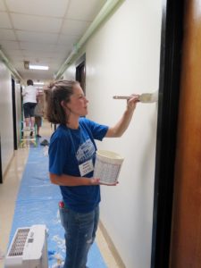 Anne Marie Amacher Marci Schwartz of St. Mary Parish-Oxford paints a wall at the Muscatine Center for Social Action in Muscatine as part of Catholics in Action-Family Style.