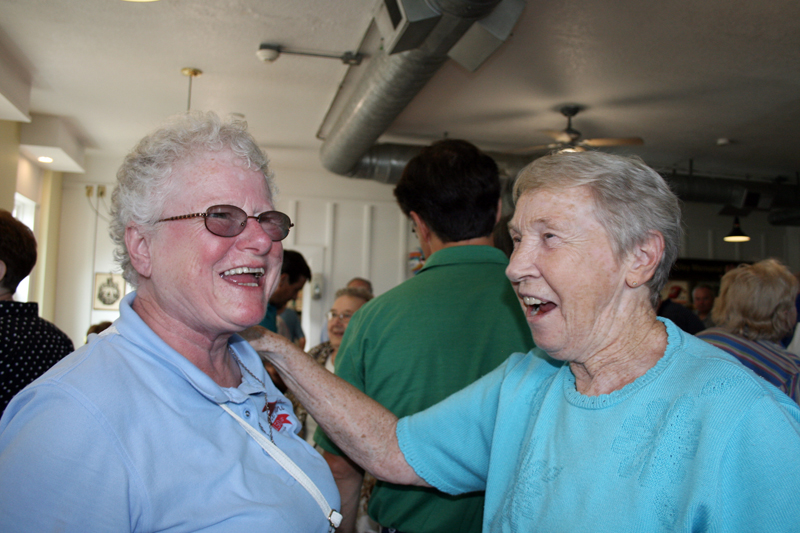 Barb Arland-Fye Sister Ruth E. Westmoreland, OSF, right, laughs with a Pat Keys, a Sojourner with  the Clinton Franciscans, during sister’s retirement party at Café on Vine in Davenport on Aug. 25.