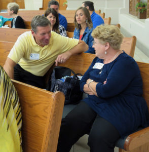 Anne Marie Amacher Deacon Bob Shaw and Mary Fritch discuss traits of a person of mercy during the Mercy in Motion — A Ministries of Mercy Conference July 30 at St. Ambrose University. The event was sponsored by the Diocese of Davenport.