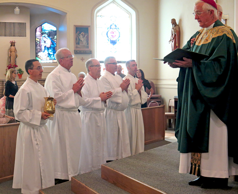 Anne Marie Amacher Bishop Martin Amos celebrates the Rite of Institution of Acolytes for Deacon Class VII. The Mass was held June 11 at St. Paul the Apostle Church in Davenport.