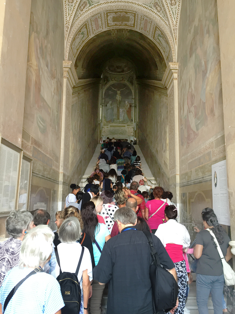 Jane Tadelski Pilgrims on a Catholic Messenger Pilgrimage to Rome and Assisi Aug. 30-Sept. 6 were among the many people who climbed the Holy Staircase in Rome on their knees. The staircase is believed to be the one Jesus climbed to enter the praetorium of Pontius Pilate in Jerusalem. Historians say the staircase was moved to Rome in the fourth century. 