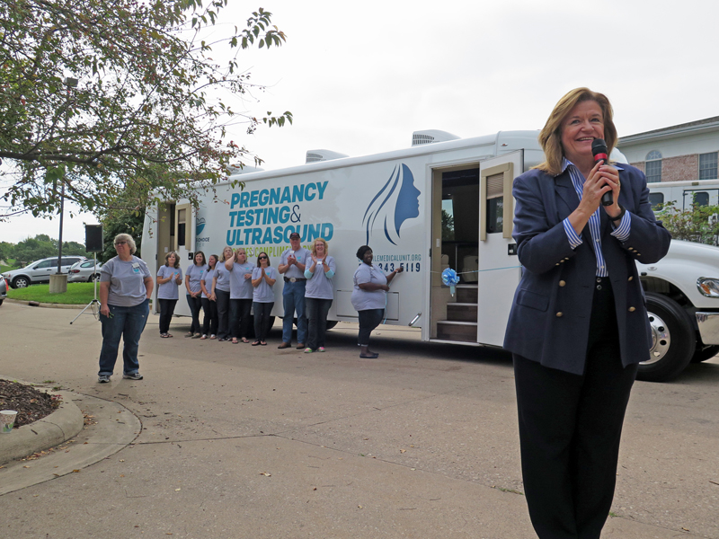 Anne Marie Amacher Mary Jones, president of the Life & Family board that oversees the Women’s Choice Center in Bettendorf, talks before the ribbon-cutting ceremony for the mobile medical unit Sept. 14. The unit will be on the road six days a week in Illinois and Iowa. For a schedule or to see what services are available, call (563) 343-5119 or visit the dedicated website at www.qcmobilemedicalunit.org. 