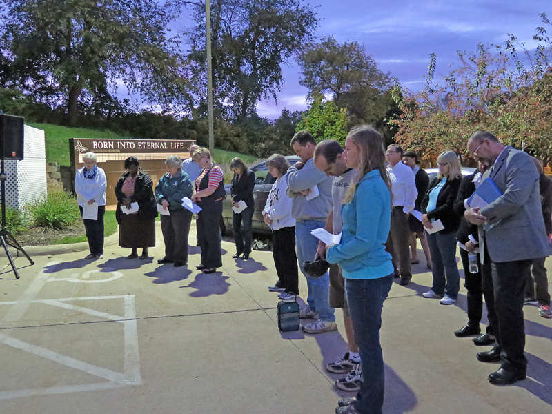 Anne Marie Amacher Pro-life supporters pray outside the Women’s Choice Center in Bettendorf at the 40 Days for Life kickoff event Sept. 27. 