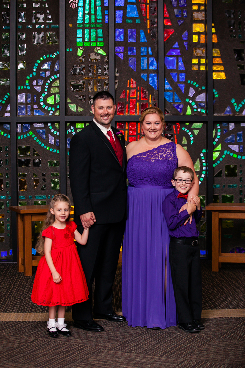 BDPStudio | bestdaysphoto.com Adeline, Jake, Emily and Asher Pries dress up for a wedding at Our Lady of Victory Catholic Church earlier this year. Jake and Emily chose to build their family through adoption following an infertility diagnosis. 