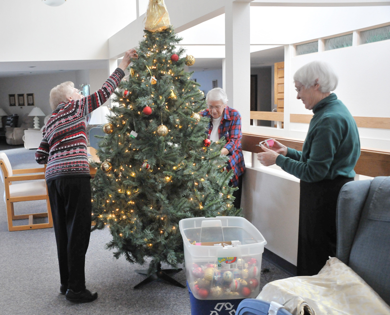 Lindsay Steele Sister Pat Miller, CHM, left, Sister Claudellen Pentecost, CHM, center, and Sister Kathleen Henneberry, CHM, decorate a tree at the Congregation of the Humility of Mary motherhouse in Davenport in this file photo from Dec 16, 2015. 