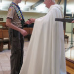 Bishop presents scouting emblems, recognitions