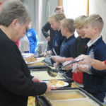 Students serve Thanksgiving meal to seniors