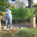 Bee the Difference Day: St. Ambrose students help neighbors with fall cleanup