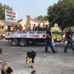 Youth group, food pantry pair up for parade
